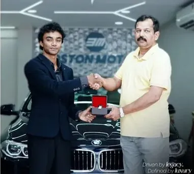 A handshake completing a BMW handover