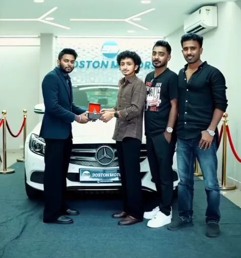 A customer receiving the keys to a Mercedes-Benz